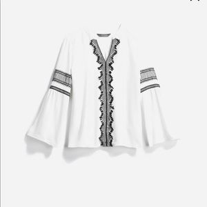 Beautiful off white top with black crochet details